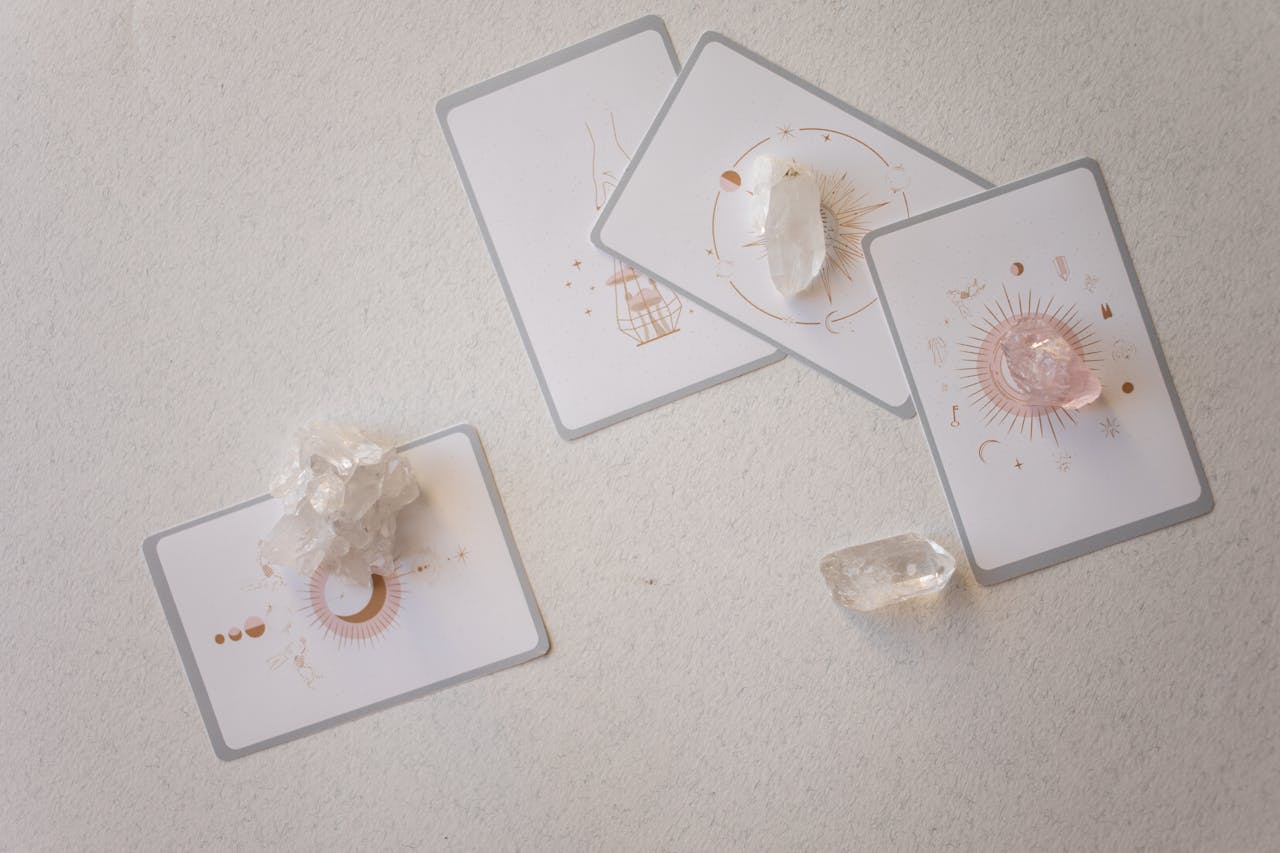 Mystical tarot cards paired with healing crystals on a serene surface, embracing spirituality.